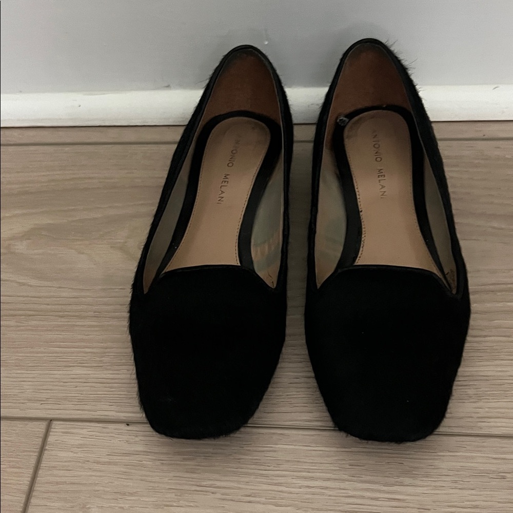 Black real hair, leather upper flat shoes. Mint condition.